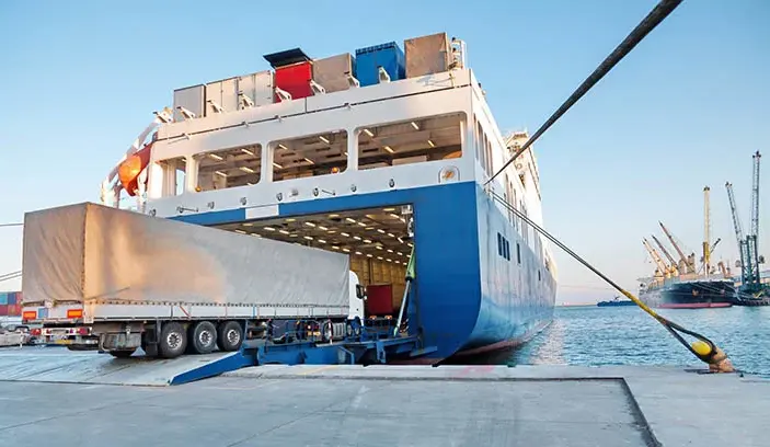 Truck driving onto a RoRo vessel for shipping to Africa